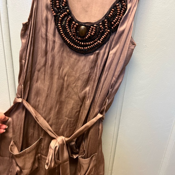 Tops - Arden 8 women sleeves less silk long top with beads around neck line. Size S.